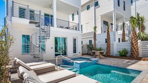 A modern two-story building with a swimming pool, outdoor seating, and palm trees. - Expansive Designer Home with Gulf Views, One Min to Beach, Private Pool, LSV (Santa Rosa Beach)