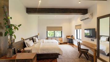 A modern hotel room with two beds, a desk, a TV, and a large window.