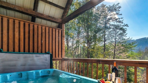 A hot tub on a wooden deck with a view of trees and mountains. - Minutes From Parkway I Private I Views I Hot tub (Pigeon Forge)