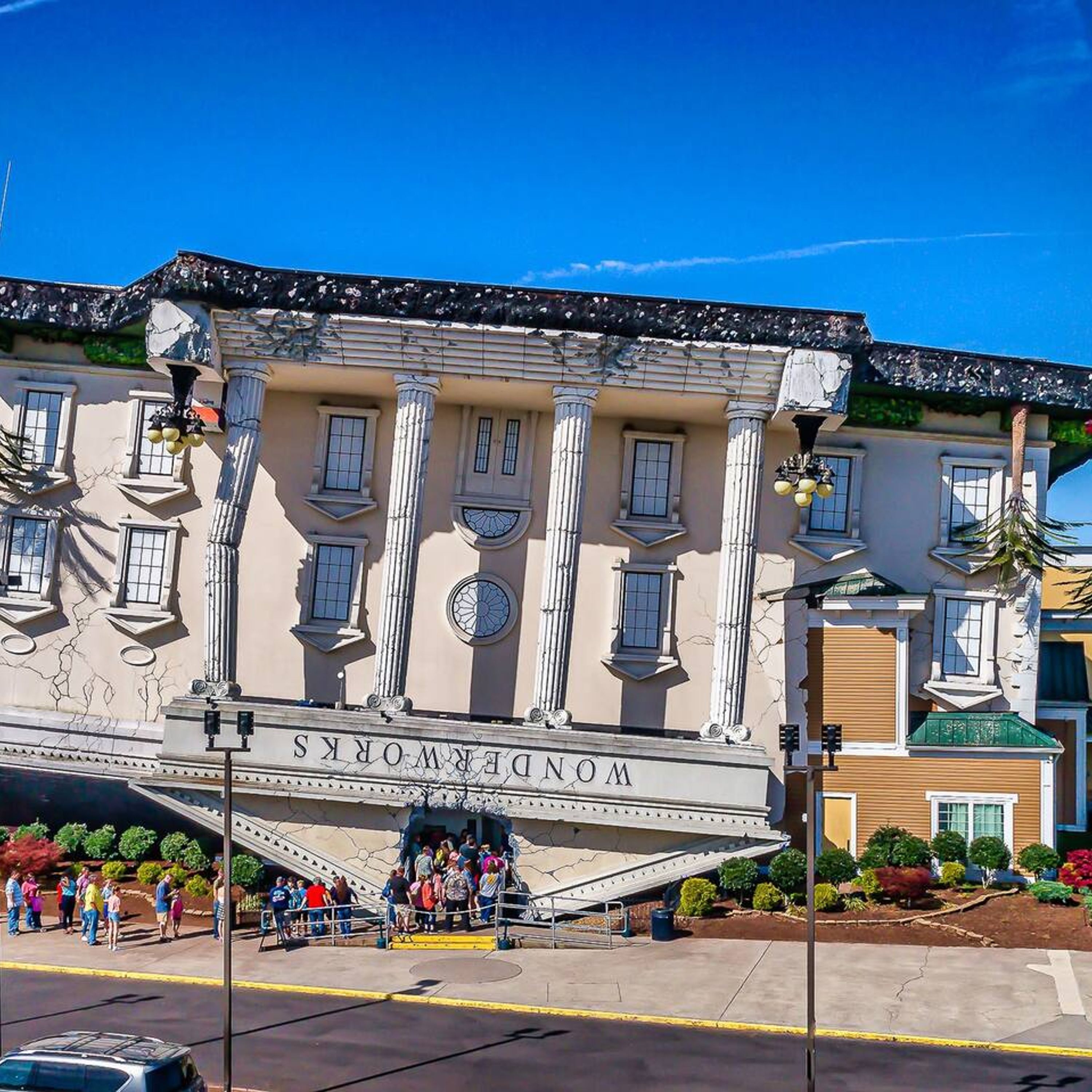 A building with classical architecture, including columns and a balcony.