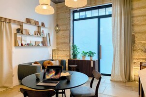 Design Apartment, City View, Ground Floor | Living area | 55-inch flat-screen TV with cable channels, Netflix, streaming services