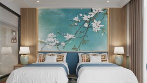 A hotel room with two beds, a large floral mural, and a modern design. - SIREN HOTEL HAI TIEN (Hoang Tien)