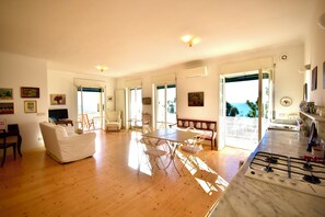Apartment | Living area | 35-inch TV with digital channels - Panorama Apartment in Ospedaletti by Wonderful Italy (Ospedaletti)