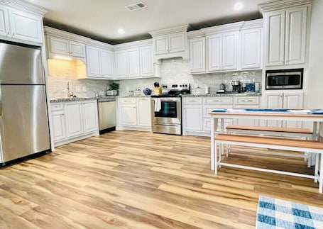 Fridge, microwave, oven, stovetop. Hues of Blue 2BR 2BA Home on Quiet Street