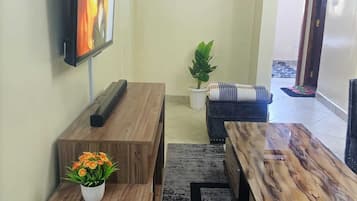 Deluxe Apartment | Living area | 42-cm Smart TV with digital channels