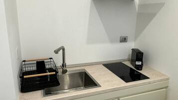 Fridge, microwave, stovetop, coffee/tea maker