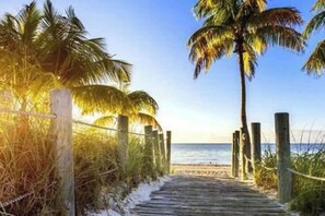 On the beach, sun loungers, beach towels