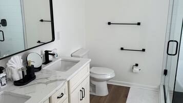 Shower, hair dryer, towels, soap