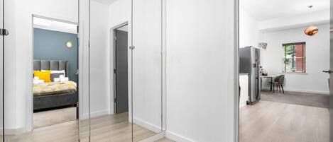 1 bedroom, desk, iron/ironing board, travel crib