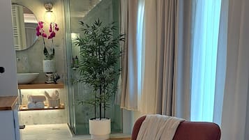 Deluxe Suite (Themis) | Bathroom | Shower, rainfall showerhead, designer toiletries, hair dryer