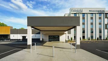 A Fairfield by Marriott hotel entrance with a covered walkway and parking lot.