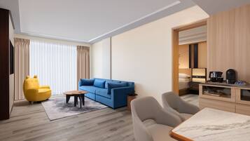 Suite, 1 King Bed, Pool View (Balcony) | Living room | 55-inch Smart TV with cable channels