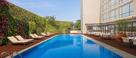 Outdoor pool, pool umbrellas, sun loungers
