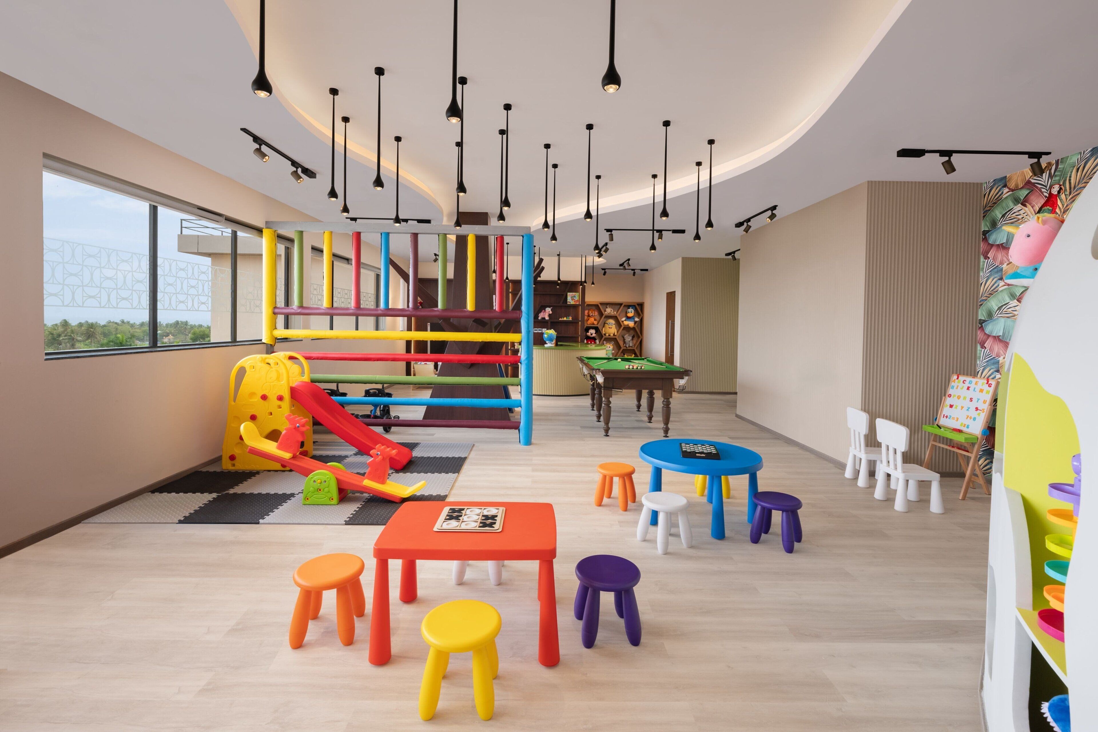 A children's play area with colorful furniture and a slide.