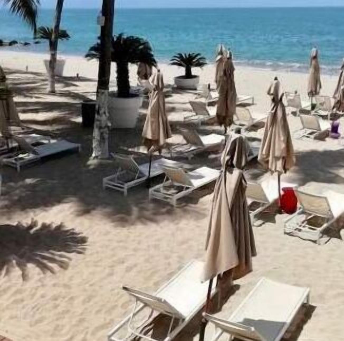 On the beach, sun-loungers, beach towels