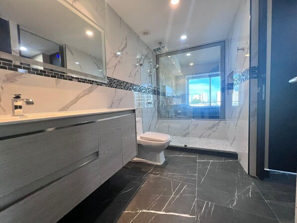 Shower, hair dryer, towels, soap