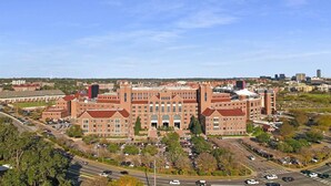 A large brick building with multiple wings and a parking lot. - Cozy 1/1 Walking distance to Doak Campbell Stadium and campus (Tallahassee)