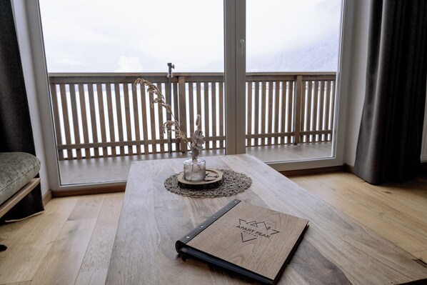 Grand Apartment, Mountain View | Living area | 55-inch LED TV with cable channels, tablet - Apart Peak Ötztal  (Laengenfeld)