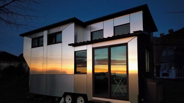 A modern, two-story house with large windows and a flat roof, situated in a residential area. - The Cyberhut (Underwood)