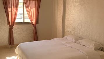 Premium bedding, memory-foam beds, laptop workspace, free WiFi