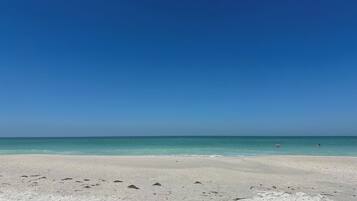 On the beach, sun loungers, beach towels