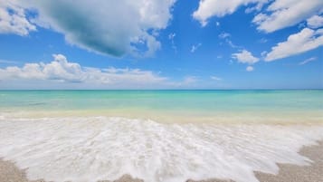 On the beach, sun loungers, beach towels