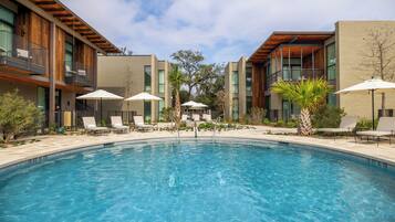 Outdoor pool, open 7:00 AM to 7:00 PM, pool umbrellas, pool loungers