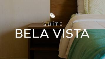 Suíte premium, vista para a cidade | 1 quarto, roupas de cama antialérgicas, frigobar