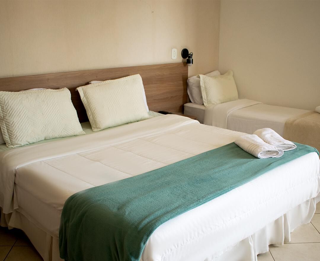 Suíte premium, vista para a cidade | 1 quarto, roupas de cama antialérgicas, frigobar