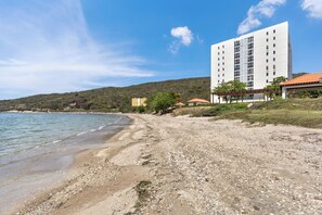 On the beach, sun loungers