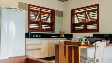 Superior Villa, Garden View | Private kitchenette | Fridge, stovetop, cookware/dishes/utensils, dining tables