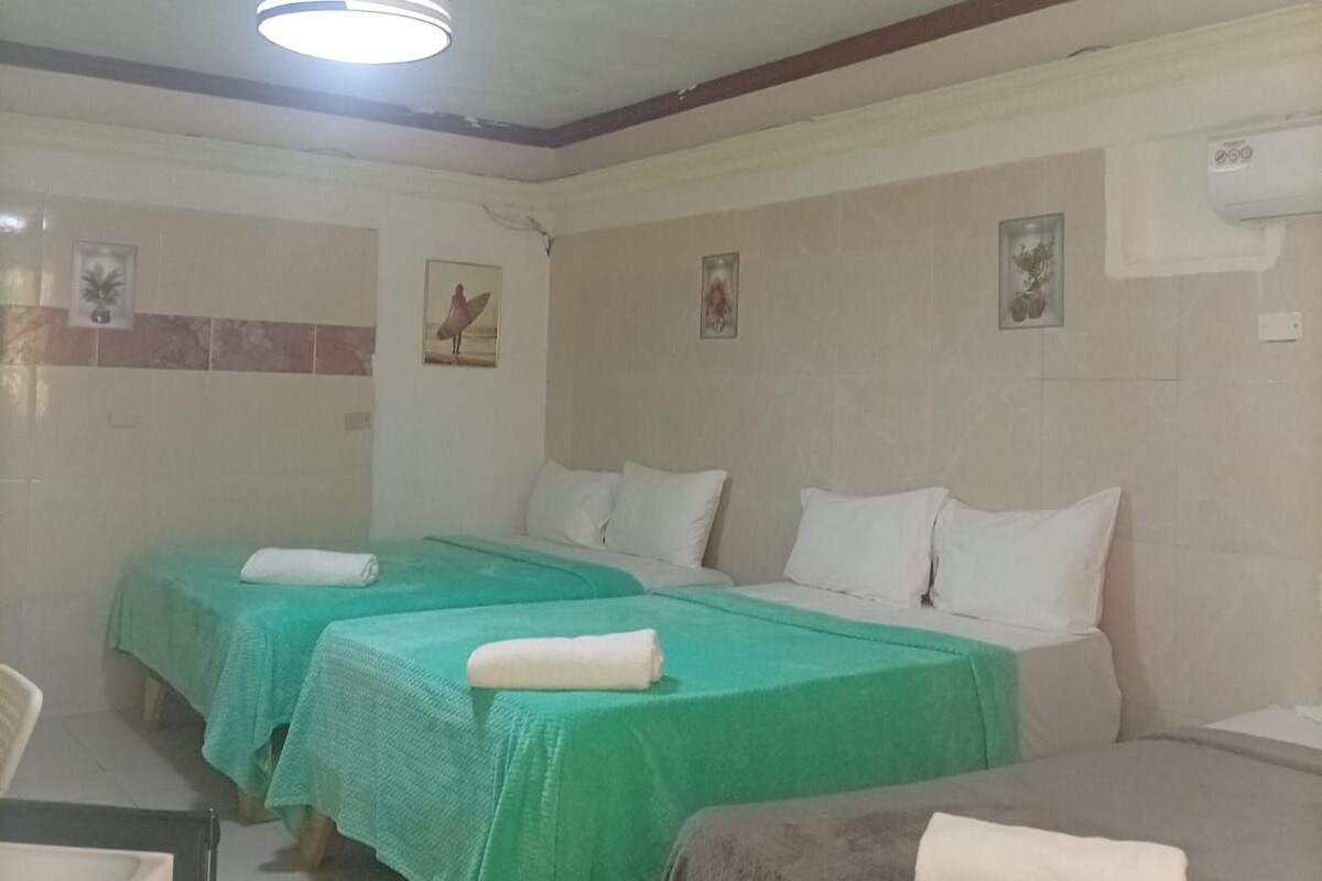 Family Triple Room, Courtyard View | In-room safe, laptop workspace, blackout drapes, WiFi (free)