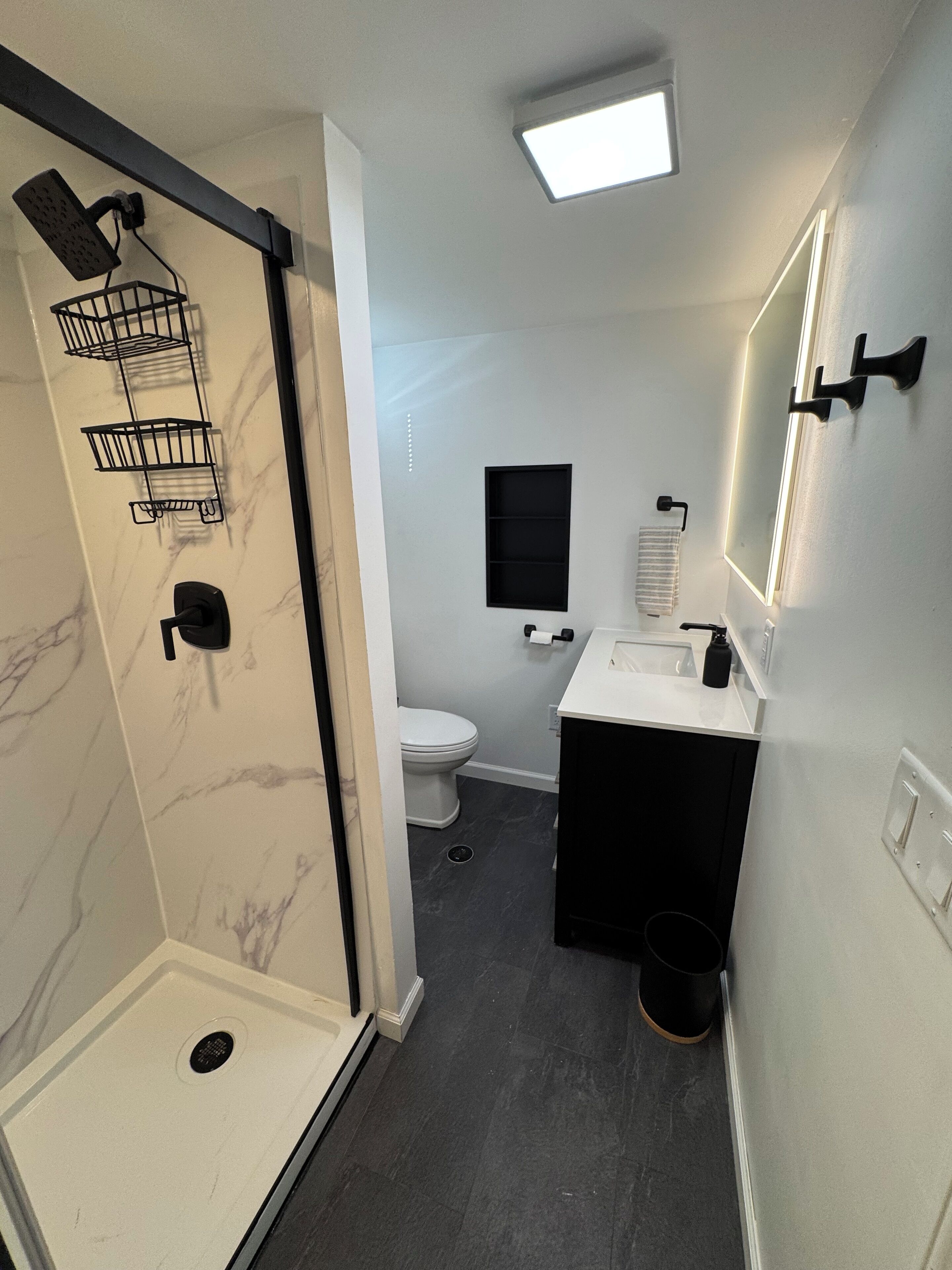 Shower, hair dryer, towels, toilet paper