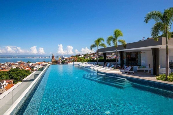 Relax by the pool and enjoy stunning views of the coastal city.