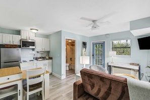 A compact living space with a kitchenette, a dining area, and a seating area. - ☀️Sunset Corner - Beach View Suite | Heated Pool • Across from Beach ➠ 16333 Gulf Blvd 215 (Redington Beach)