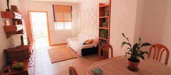 Apartment with pool near the beach and a park with sports facilities.