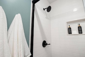 Shower, hair dryer, towels, soap
