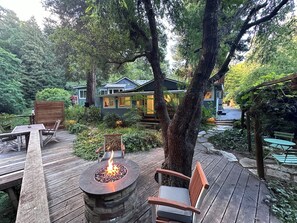 Relax on the deck with a fire pit and comfortable seating.