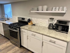 Coffee/tea maker, fridge, microwave, oven
