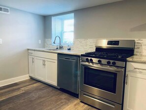 Coffee/tea maker, fridge, microwave, oven