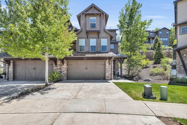 Exterior: View of the front of the home, driveway w/parking space for 2 cars and 1 car in the garage