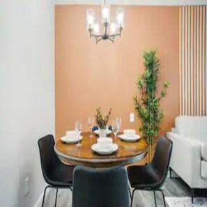 Enjoy meals with family and friends in this cozy dining area, complete with a round table and comfortable seating for four.