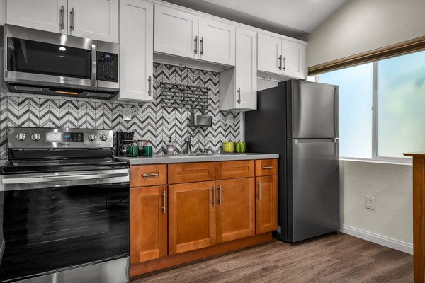 Fully Stocked and Equipped Kitchen Refrigerator Stove/Oven, Microwave