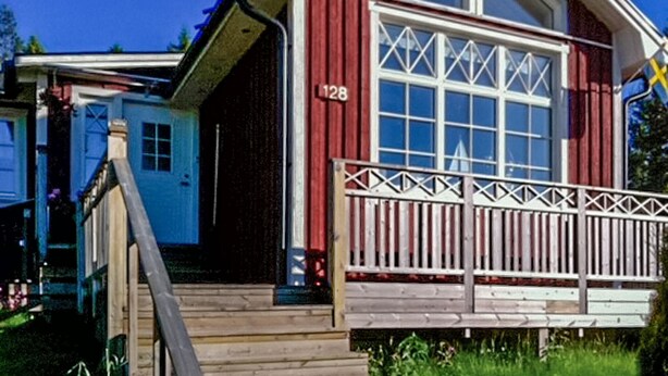 A red building with a large window and a number 128 on the side. - 4 bedroom lovely home in Njurunda (Njurunda)