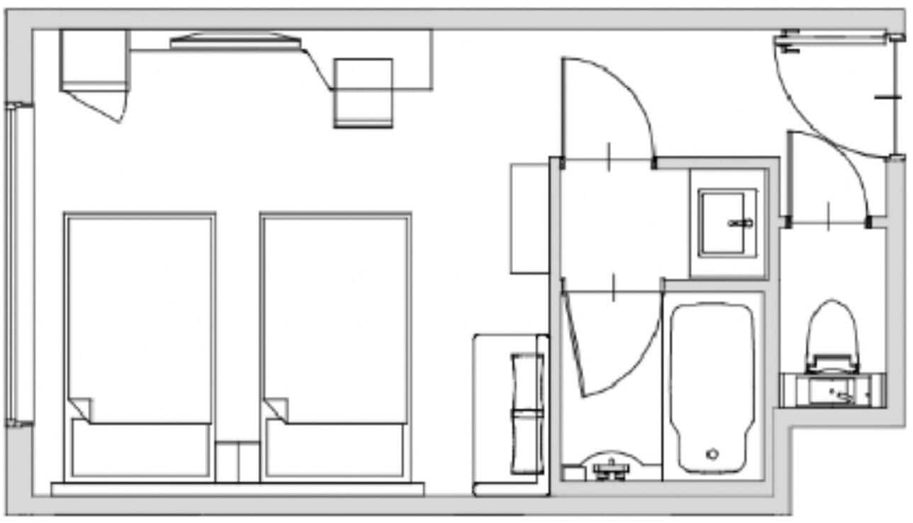 A floor plan with two large bedrooms, a bathroom, a kitchen, and a living area.