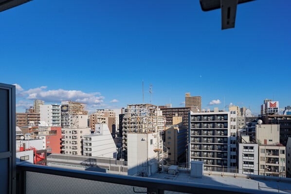 A cityscape with various buildings, including a mix of residential and commercial structures.