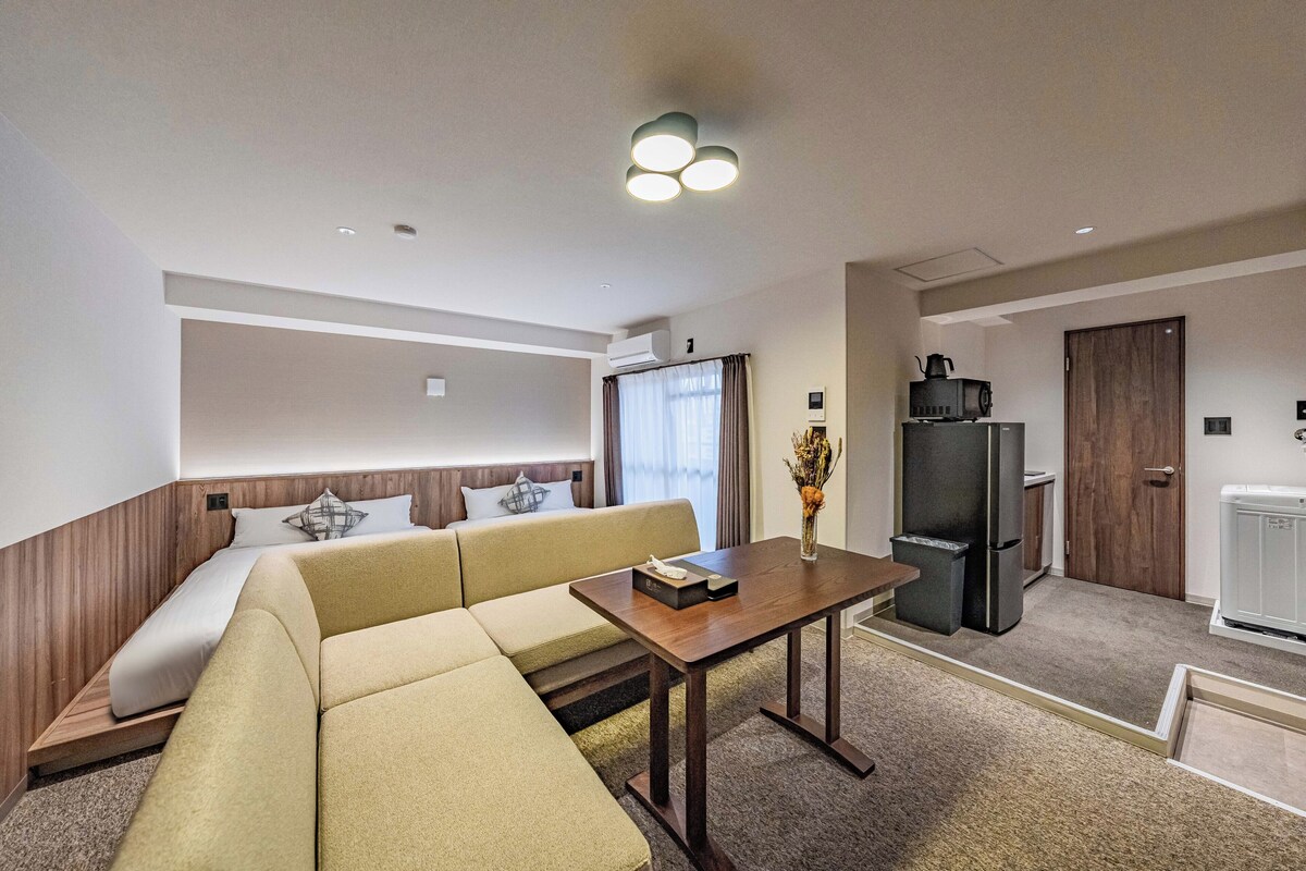 Deluxe Quadruple Room, Balcony | Down comforters, WiFi (free), bed sheets