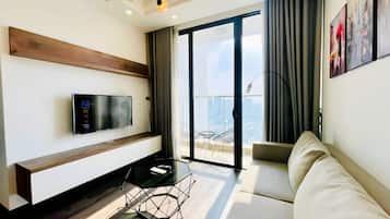 Luxury Apartment, 3 Bedrooms, Private Bathroom, City View | Living area | 60-inch flat-screen TV with cable channels, pay movies