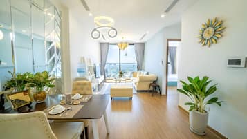 Luxury Apartment, 1 Queen Bed with Sofa bed, Private Bathroom, City View | Living area | 60-inch flat-screen TV with cable channels, pay movies