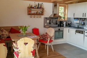 Fridge, oven, stovetop, dining tables